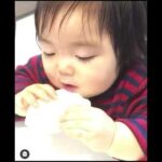 Cute asian baby eating while sleeping