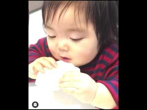 Cute asian baby eating while sleeping