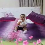 Cute Baby boy having fun with bunny soft toy - baby play - baby toys