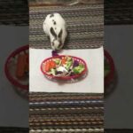 Cute bunny eating veggies