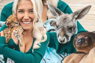 Holding baby African Servals, Joeys, and sloths