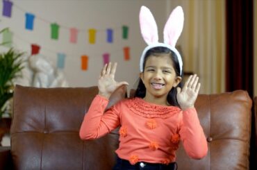 Pretty Indian girl waving her hands in a cute bunny hairband -... | Indian Stock Footage | Knot9