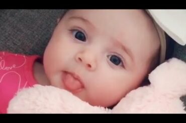 Cute Baby Holding a Bunny