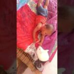 cute baby playing with rabbit