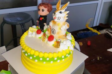 Birthday cake decorated for a boy doll and a cute bunny🐇🐰🍀🌺🌷🌻🌺🌷🌹💐🌿🌴🌳🌲