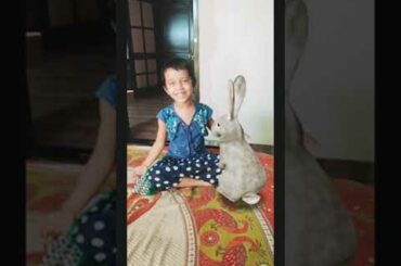 Baby playing with rabbit ( virtual)