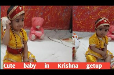 Cute baby in Krishna getup/Modern Krishna eating chocolate