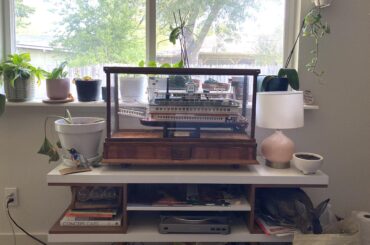 “Why would you keep that wood toy for me incased in glass?” She edges steadily closer (and can reach the hay that way)