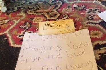 I was putting away a board game and I had the lid of the box next to me, and it had some cards in it. Benny comes beside me, reaches into the box, grabs a card, and then bolts. He runs away just holding the card in his mouth and then stares at me all goofy like. I was not able to get a picture, sad.