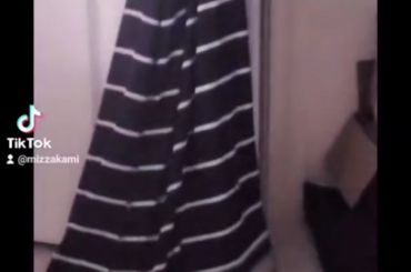 Sunny playing peek-a-boo with my sweater lol