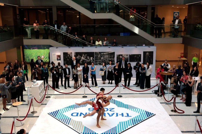 File photo dated April 14 shows attendees of the 2026 International Monetary Fund (IMF) and World Bank Group Spring Meetings watching a Muay Thai fight demonstration in Washington, DC. The 2026 Annual Meetings of the International Monetary Fund and the World Bank Group will commence on Monday until Oct 18. AFP
